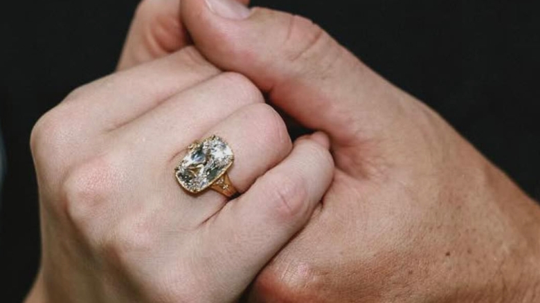 taylor swifts cushion cut diamond engagement ring from travis kelce is fast becoming hollywoods must have sparkler after it was also spotted on zendaya millie bobby brown and l 68aeda2d5dae6