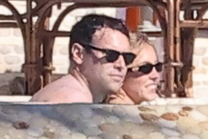 sydney sweeney 28 wears plunging swimsuit as she snuggles up to boyfriend scooter braun 44 during sun soaked pool day 69264f0c0fc83