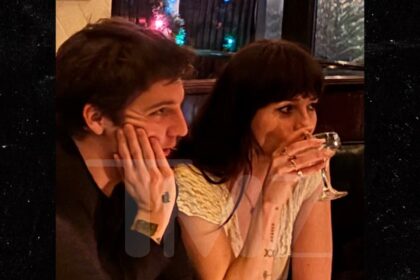 dakota johnson and role model seen getting cozy together at dinner in l a 69530d3e284ec